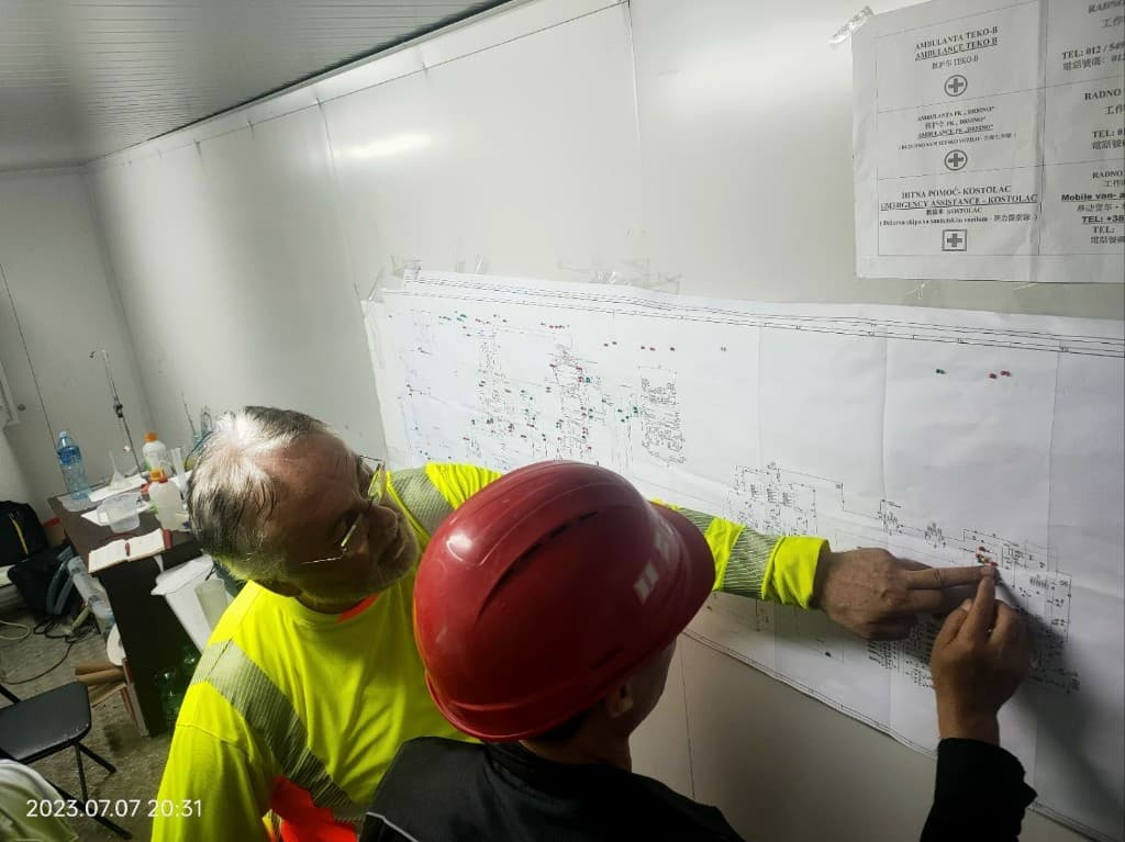 Engineers reviewing P&ID drawings on site